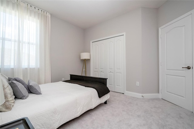 carpeted bedroom with a closet