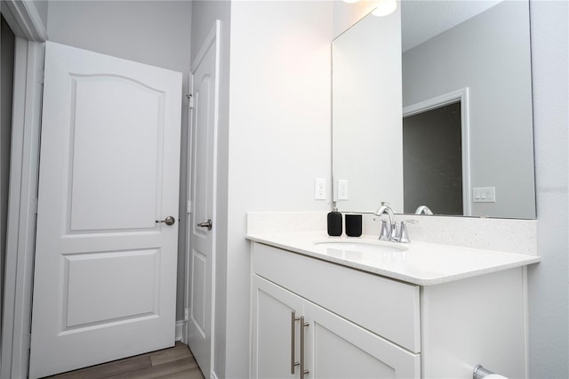 bathroom featuring hardwood / wood-style floors and vanity