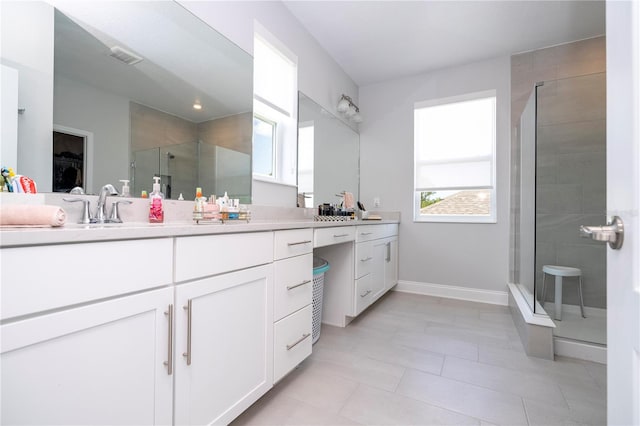 bathroom featuring tile floors, dual bowl vanity, and walk in shower