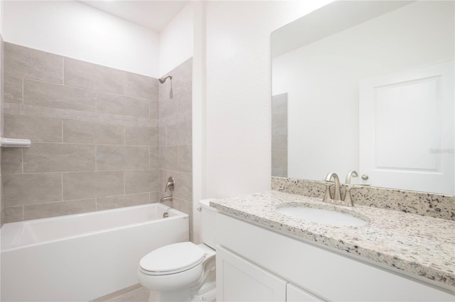 full bathroom featuring vanity, toilet, and tiled shower / bath