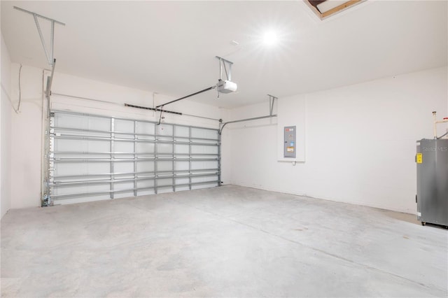 garage featuring a garage door opener, electric panel, and water heater