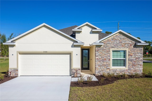 view of front of home with a garage and a front lawn