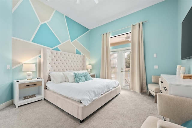 carpeted bedroom with french doors, access to outside, and ceiling fan