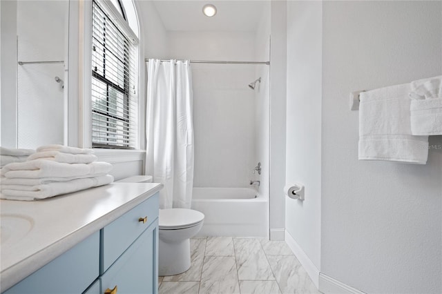 full bathroom featuring shower / tub combo, vanity, and toilet