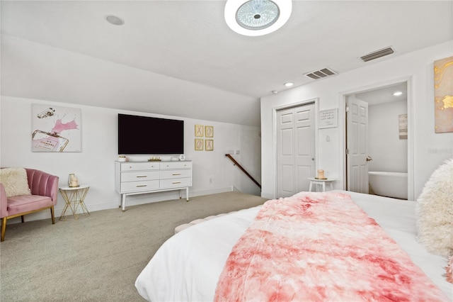 carpeted bedroom with lofted ceiling