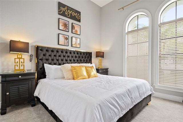 bedroom with light colored carpet