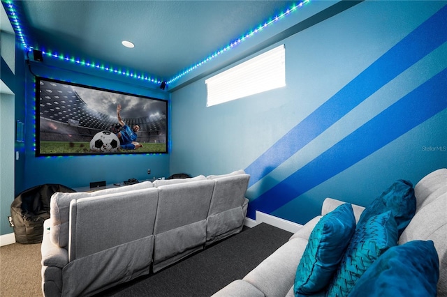 home theater featuring carpet floors and baseboards