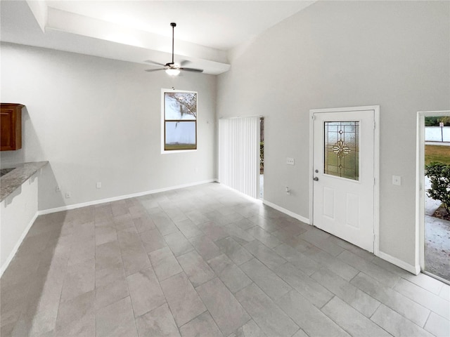 interior space featuring ceiling fan and light tile flooring