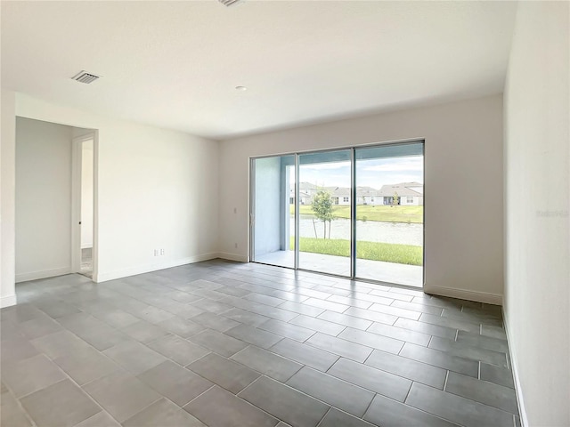 spare room with tile patterned flooring