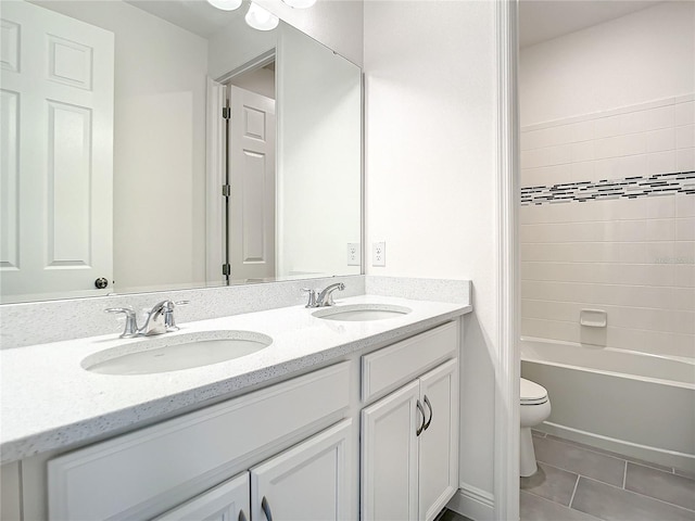 full bathroom with tile patterned floors, vanity, shower / bathtub combination, and toilet