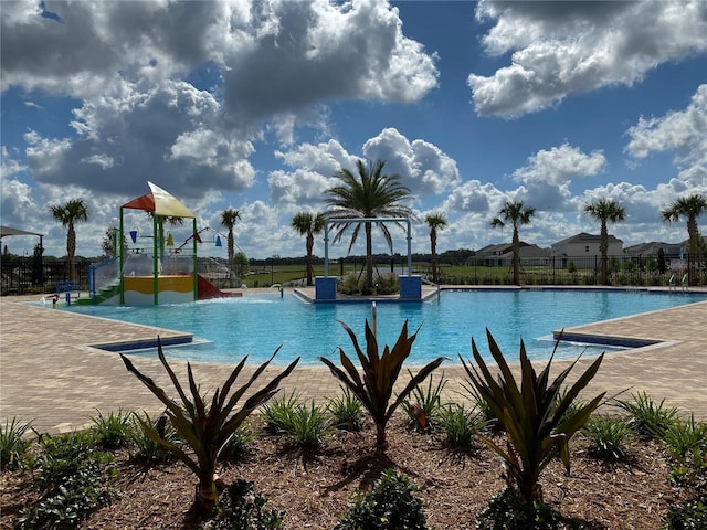 view of pool with pool water feature