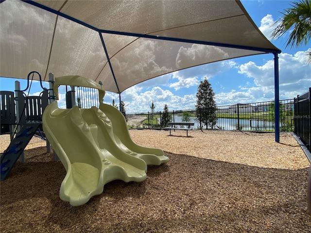 view of playground featuring a water view