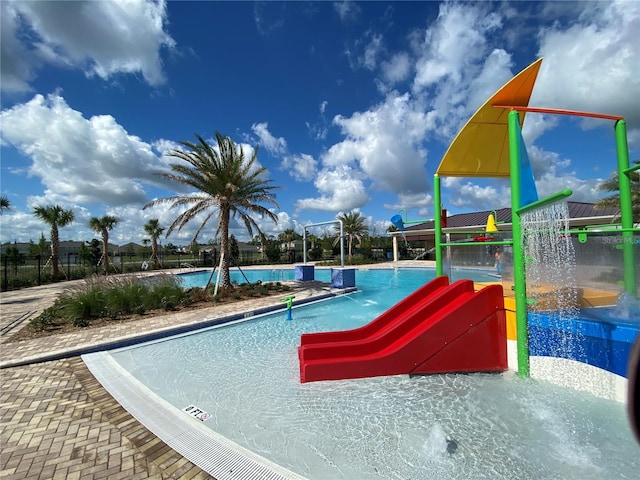 view of pool with pool water feature