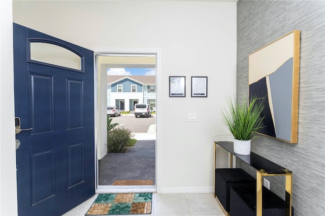 entrance foyer featuring light tile floors