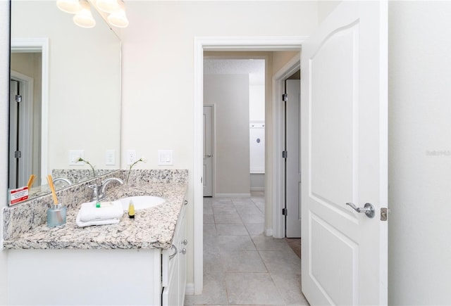 bathroom featuring oversized vanity and tile flooring