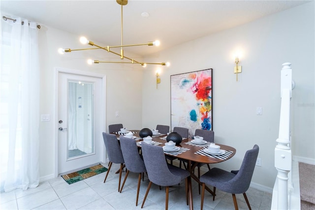 dining area with an inviting chandelier and light tile floors