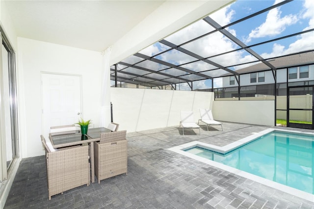 view of pool with a lanai and a patio area