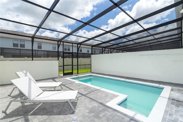 view of pool featuring a patio and a lanai