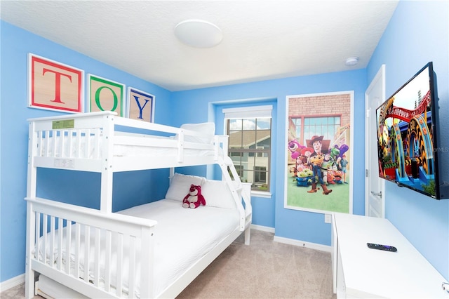 carpeted bedroom with a textured ceiling