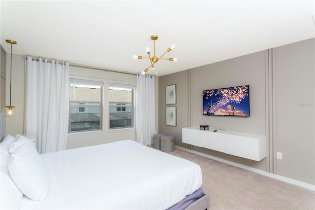 bedroom featuring a chandelier and light carpet