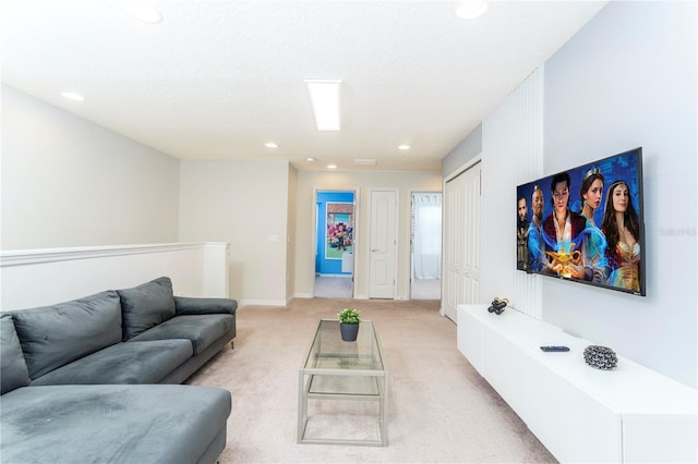 carpeted living room featuring a textured ceiling