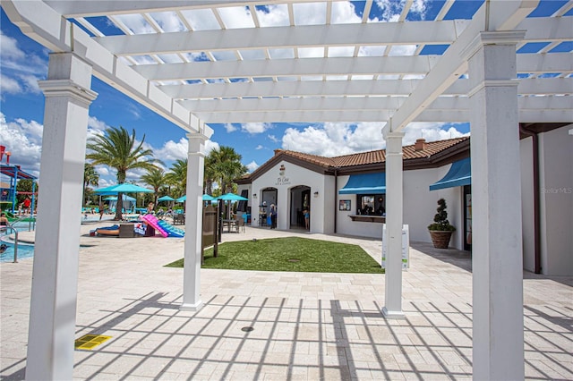 view of terrace with a pergola