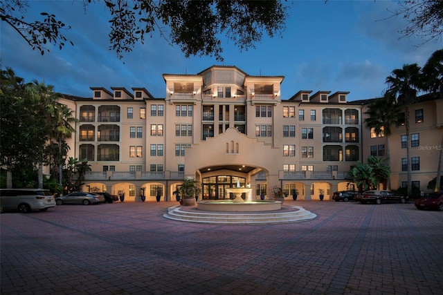 view of outdoor building at dusk