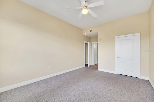 spare room featuring carpet flooring and ceiling fan