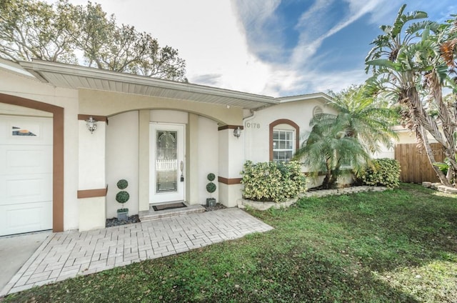 exterior space featuring a front yard and a garage