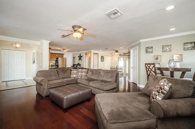 living room featuring crown molding, dark hardwood / wood-style floors, and ceiling fan