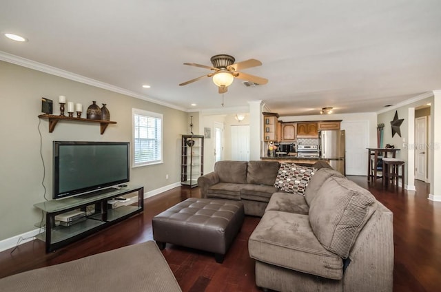 living room with crown molding, dark hardwood / wood-style flooring, and ceiling fan