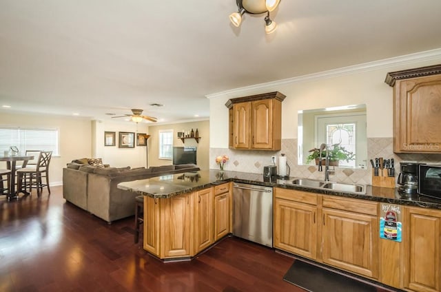 kitchen featuring kitchen peninsula, dark wood-type flooring, stainless steel dishwasher, and ceiling fan