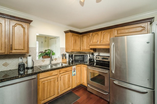 kitchen featuring sink, crown molding, dark hardwood / wood-style flooring, appliances with stainless steel finishes, and backsplash