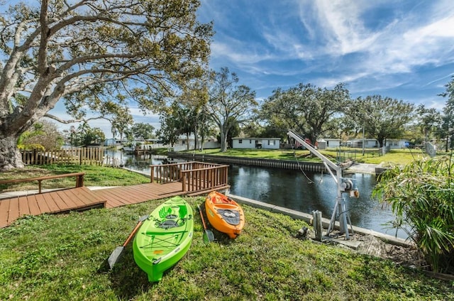 exterior space with a water view and a boat dock