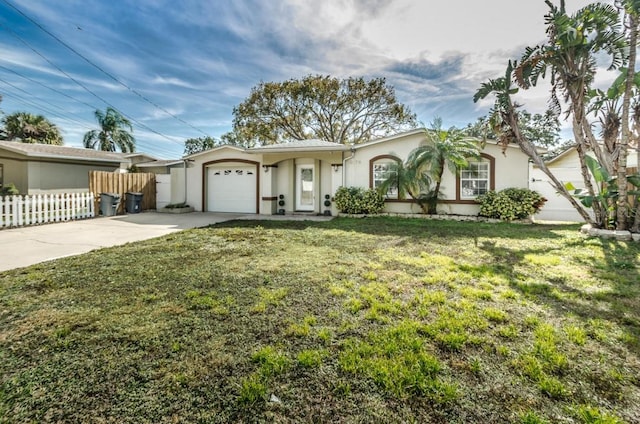 single story home with a front yard and a garage