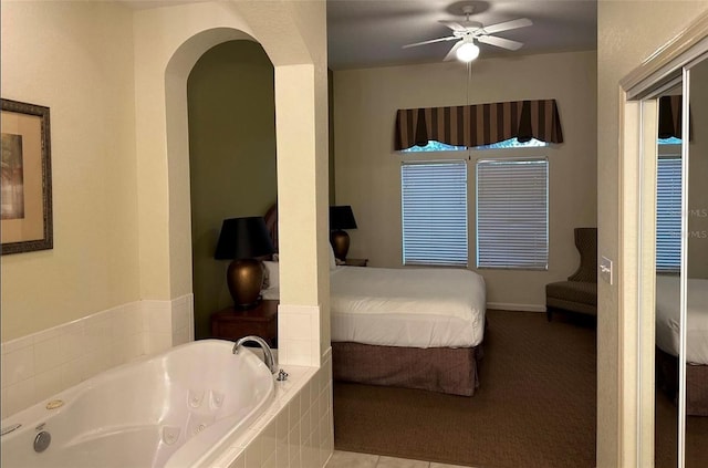 bedroom with ceiling fan and light carpet