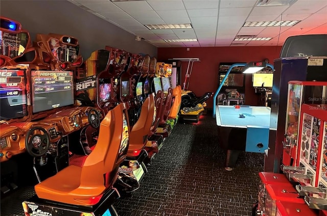 game room featuring a paneled ceiling