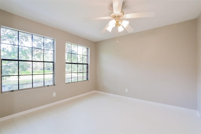 unfurnished room with ceiling fan