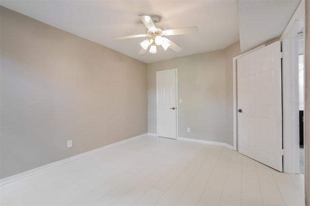 unfurnished bedroom featuring ceiling fan and light wood-type flooring