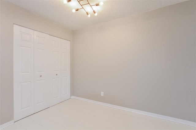 unfurnished bedroom with a closet