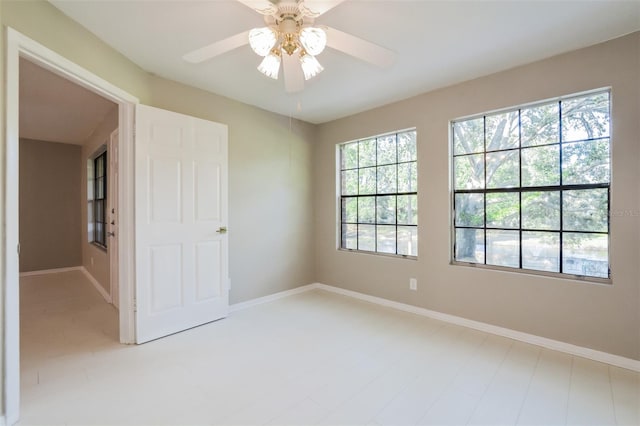 unfurnished room featuring ceiling fan