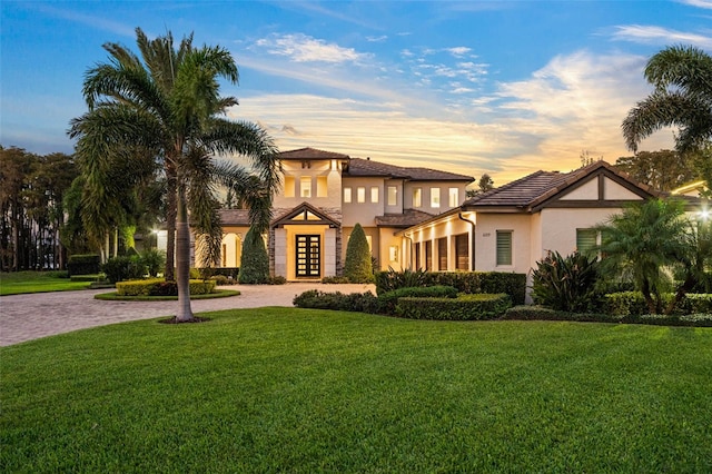 view of front of property with a lawn