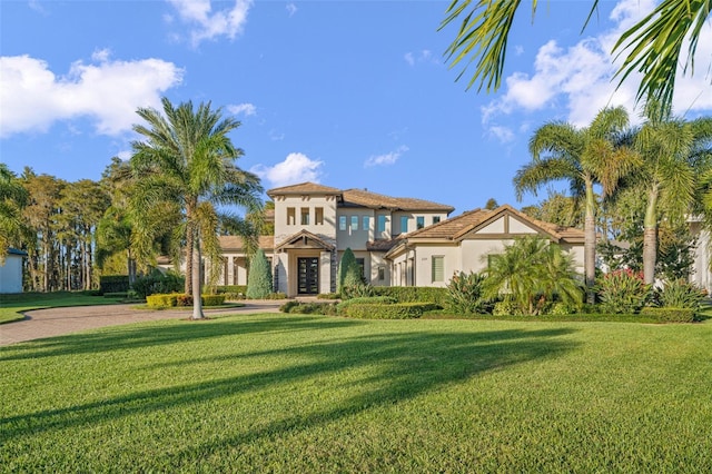 6109 Orta Ct, Windermere, FL 34786 - mediterranean / spanish-style house with stucco siding, a front yard, and french doors