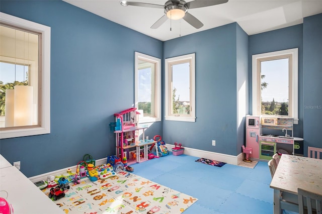 6109 Orta Ct, Windermere, FL 34786 - recreation room with healthy amount of natural light, baseboards, ceiling fan, and tile patterned floors