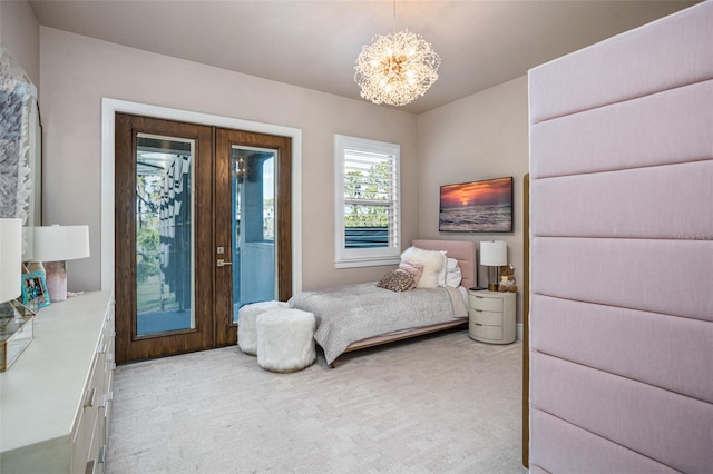 carpeted bedroom with an inviting chandelier