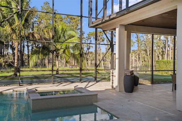 unfurnished sunroom featuring a pool with hot tub