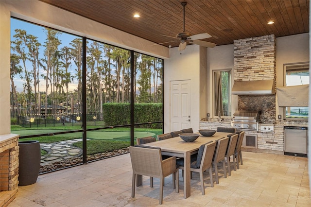 dining room featuring wood ceiling, a high ceiling, and ceiling fan