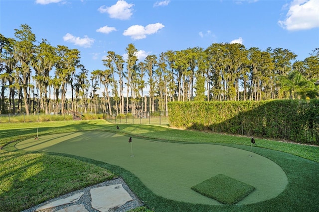 6109 Orta Ct, Windermere, FL 34786 - surrounding community with a putting green, golf course view, and view of wooded area