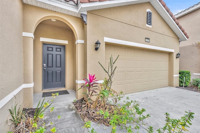 property entrance featuring a garage