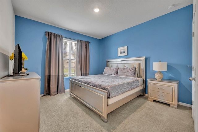 bedroom with light carpet